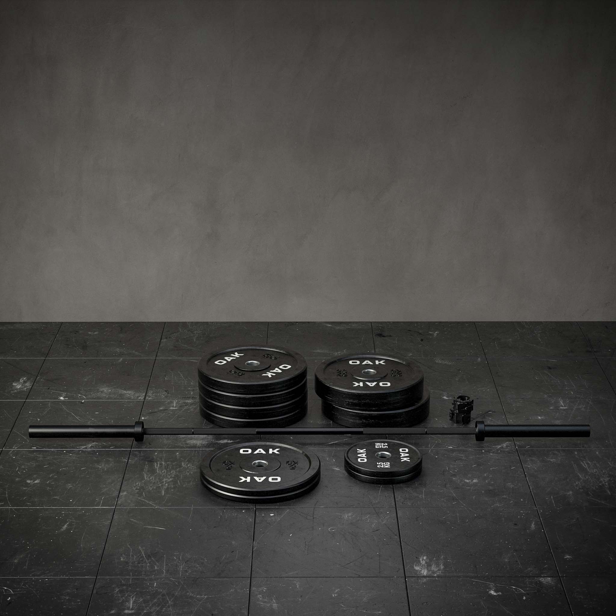 Ett skivstångsset med Crossfitstång och flera viktskivor